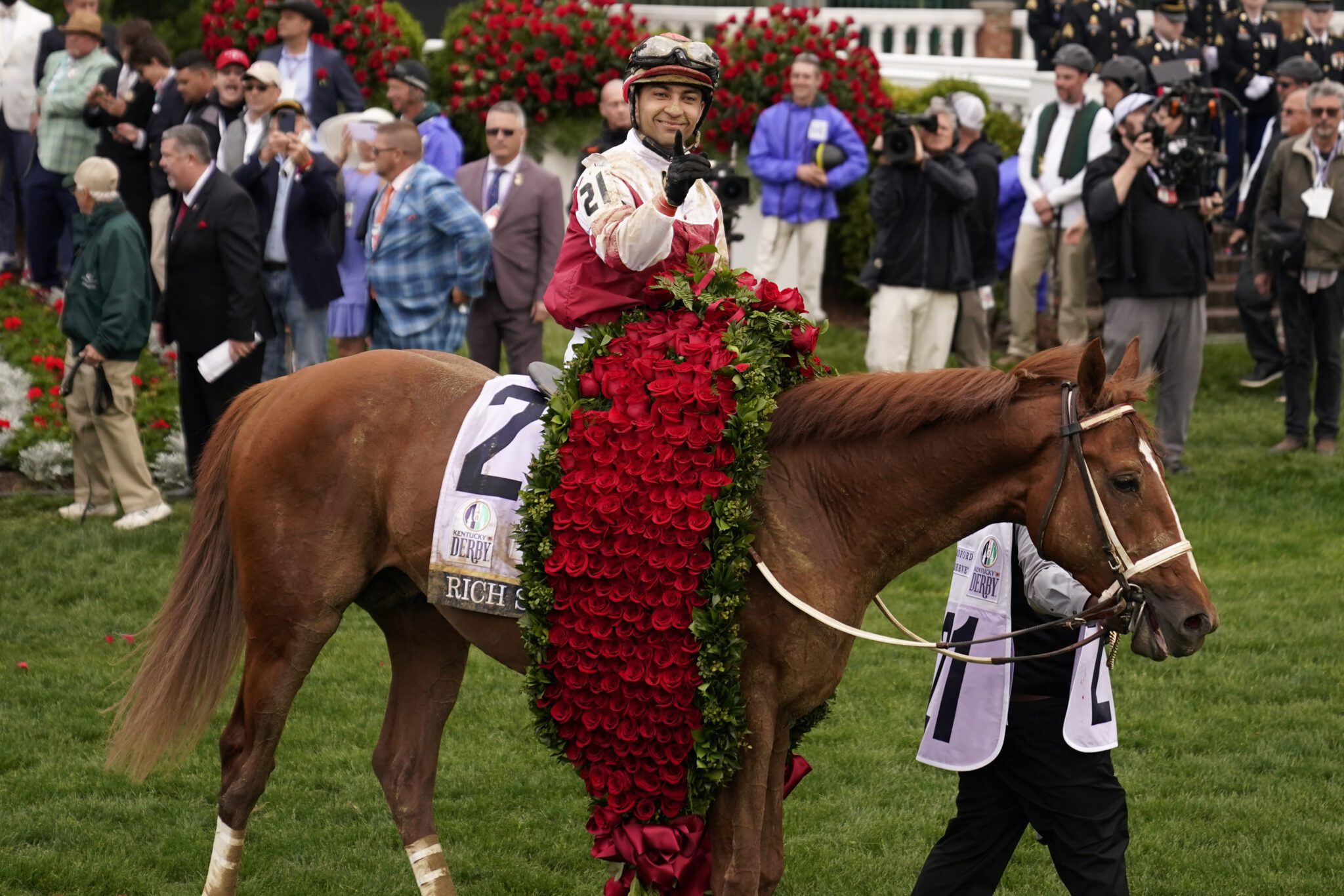 Sonny Leon rides Rich Strike in the winner's circle after winning the 148th running of the Kentucky Derby horse race at Churchill Downs Saturday, May 7, 2022, in Louisville, Ky. (AP Photo/Jeff Roberson)